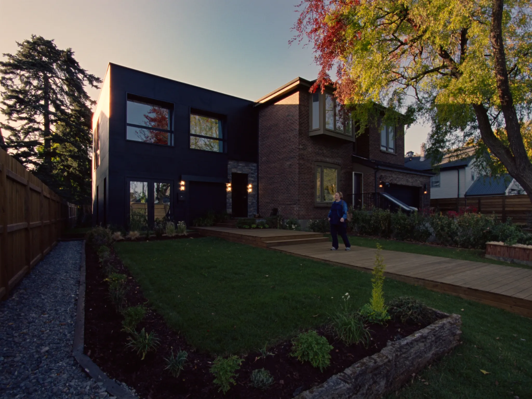 Birchwood rear addition: modern two-storey extension with black-framed windows and cedar deck