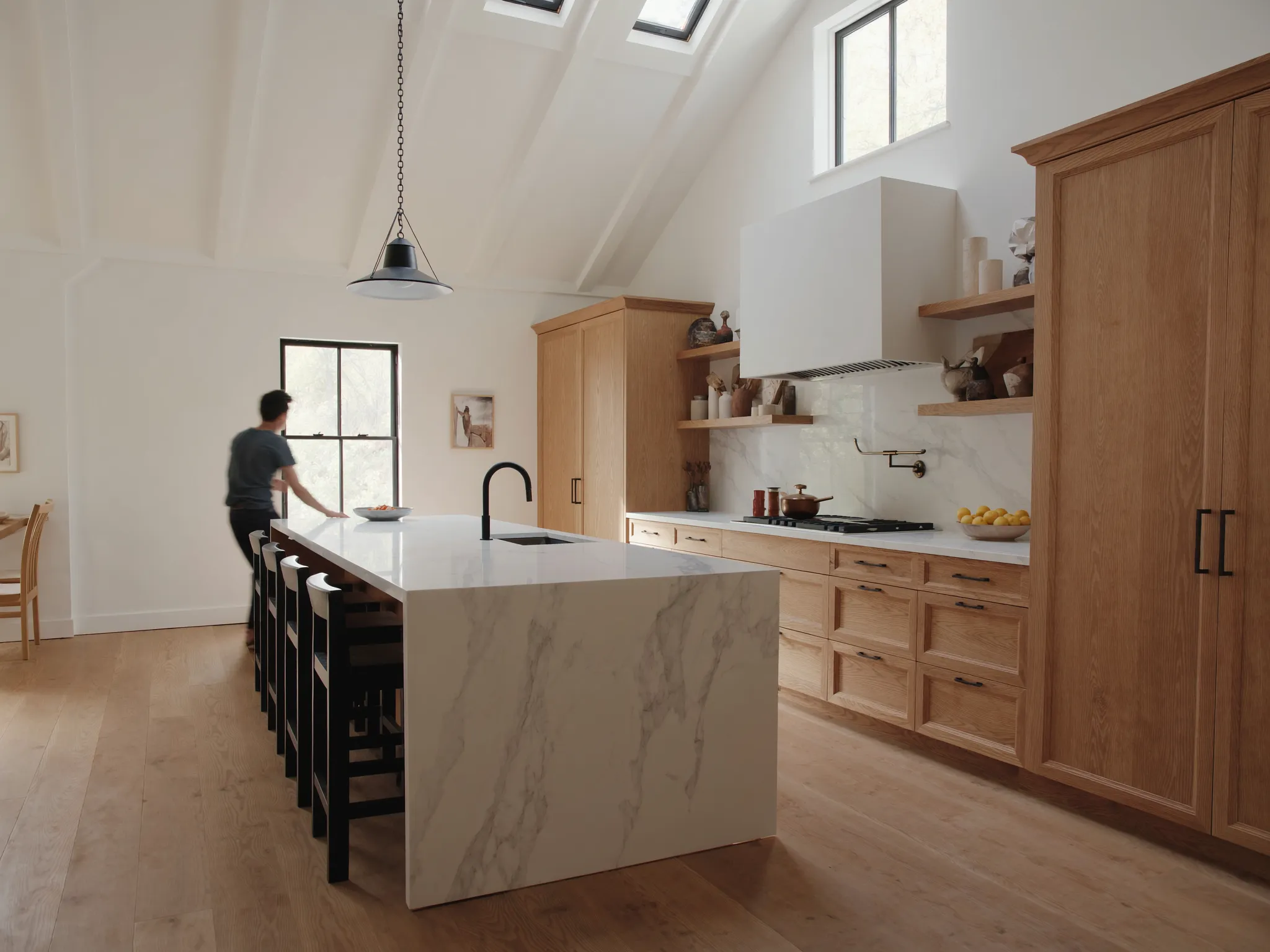 Maplehurst kitchen after renovation: rift-oak millwork and quartz island